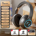 Wireless Bluetooth gaming headset with subwoofer, noise reduction, and breathing light in black colour on a desk.