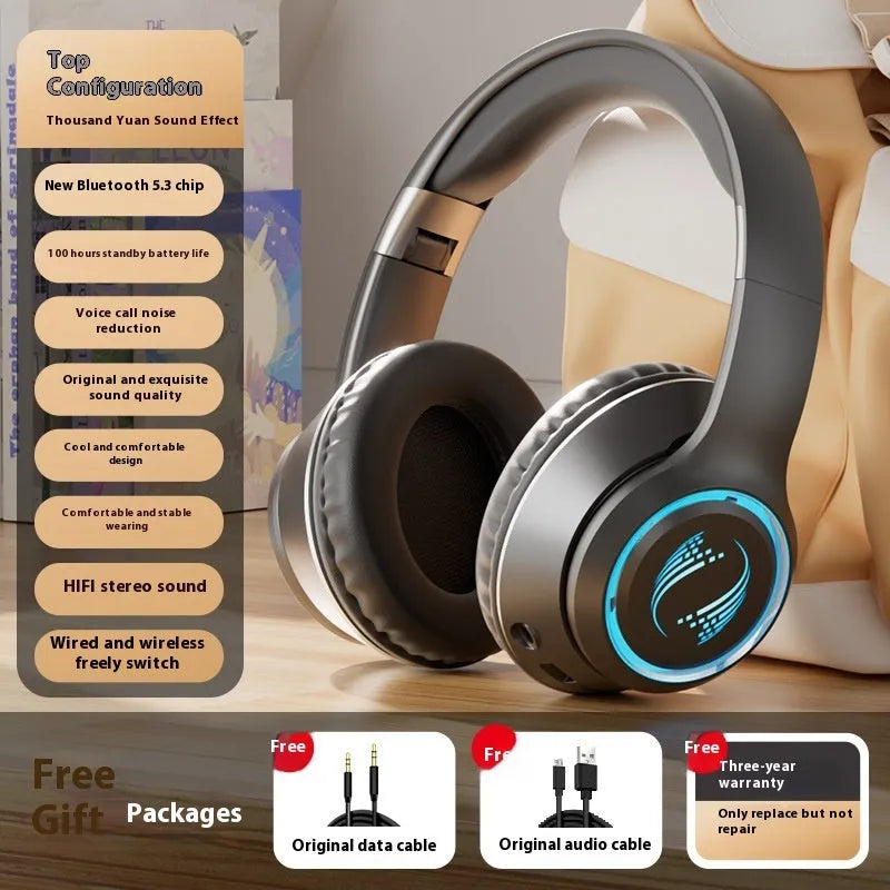 Wireless Bluetooth gaming headset with subwoofer, noise reduction, and breathing light in black colour on a desk.