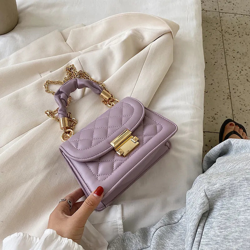 Women's purple rhombus square shoulder bag with crossbody strap showing structured design