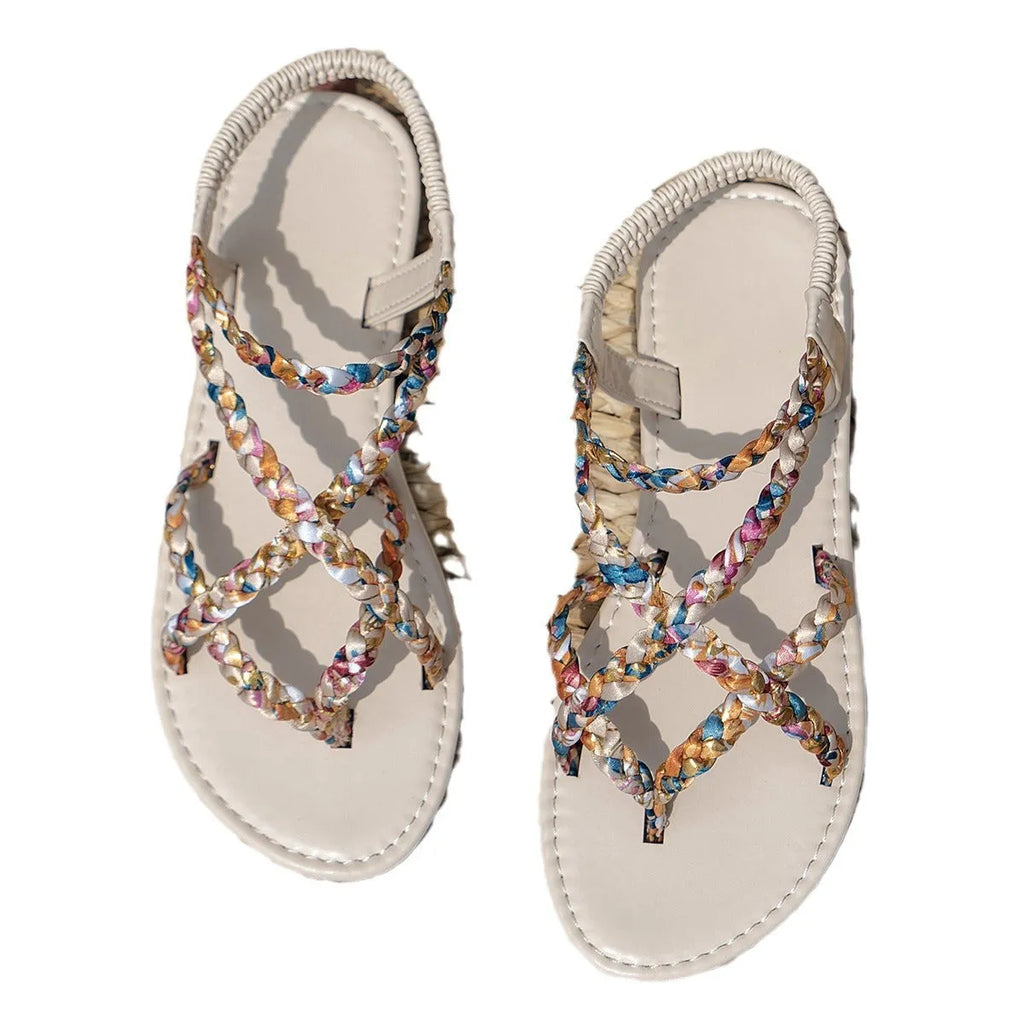 White cloth flat sandals with elastic band fastening and round toe on a plastic sole
