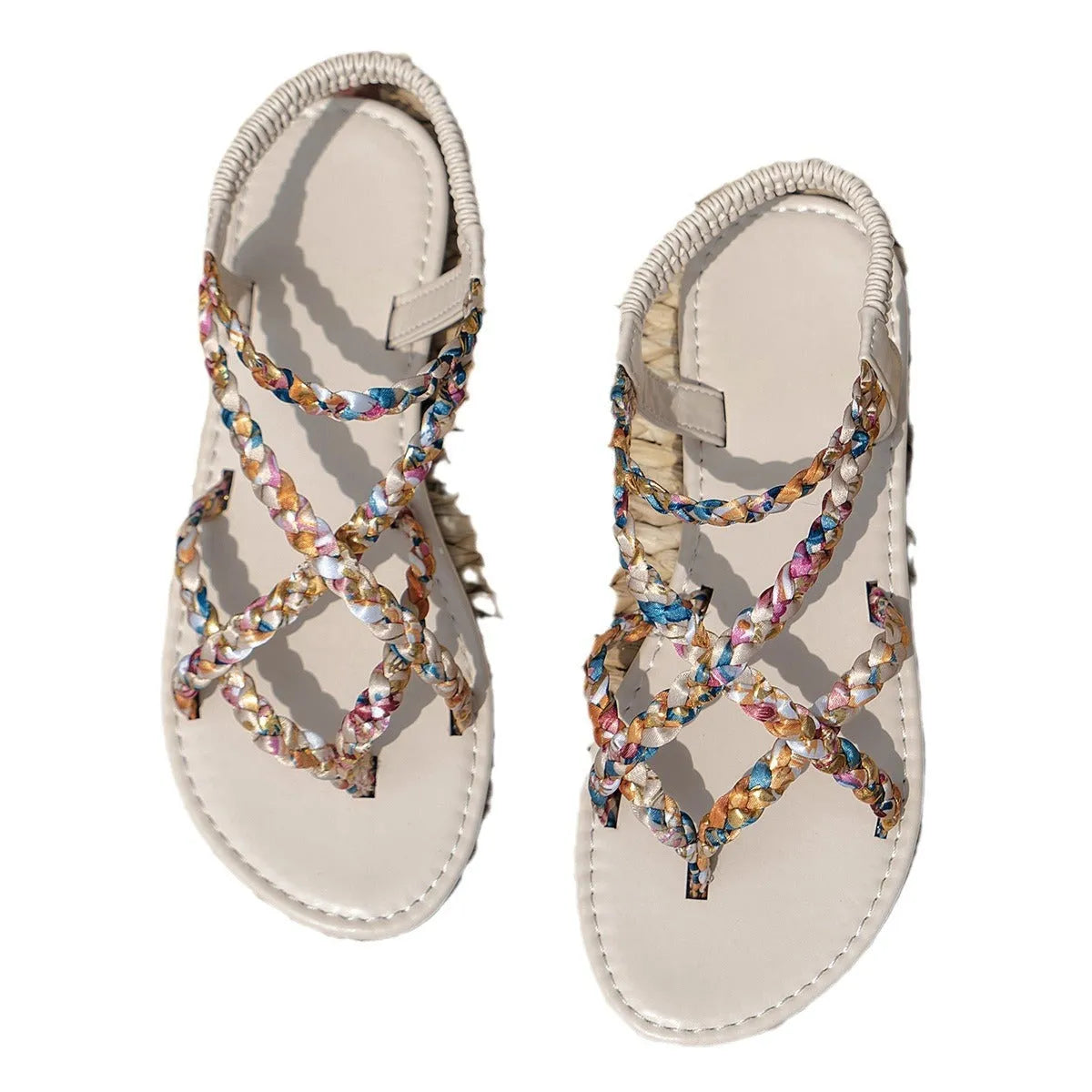 White cloth flat sandals with elastic band fastening and round toe on a plastic sole