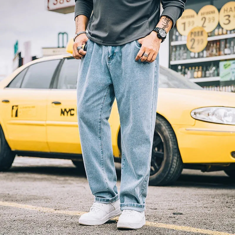 Men's loose straight jeans in dark blue, light blue and grey colours showing simple casual style