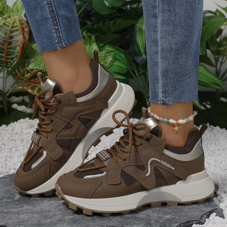 Brown casual clunky sneakers with round toe, lace-up closure, and flat rubber sole on a neutral background