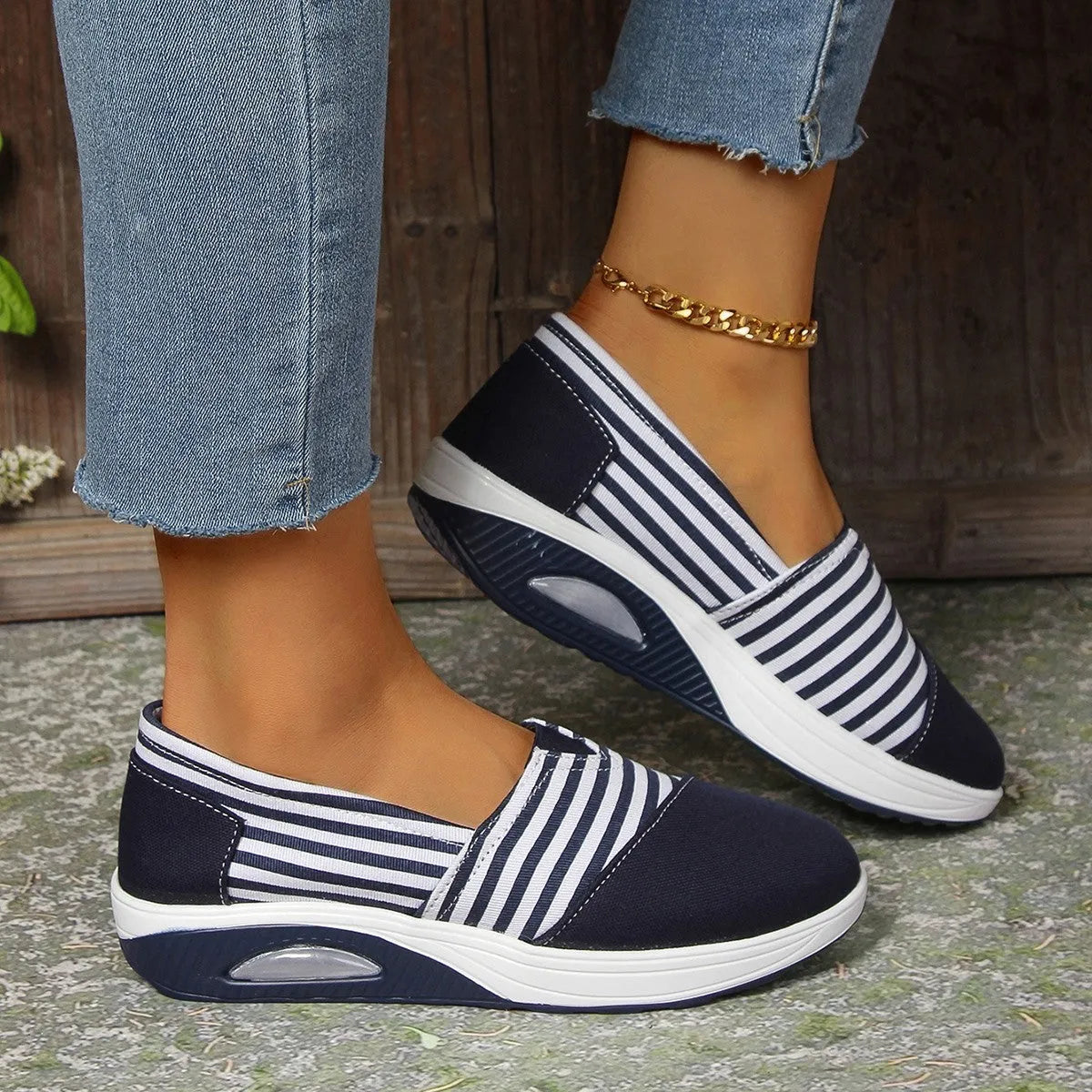 Striped canvas casual women's shoes with round head, low-top upper, and flat platform heel in blue and red.