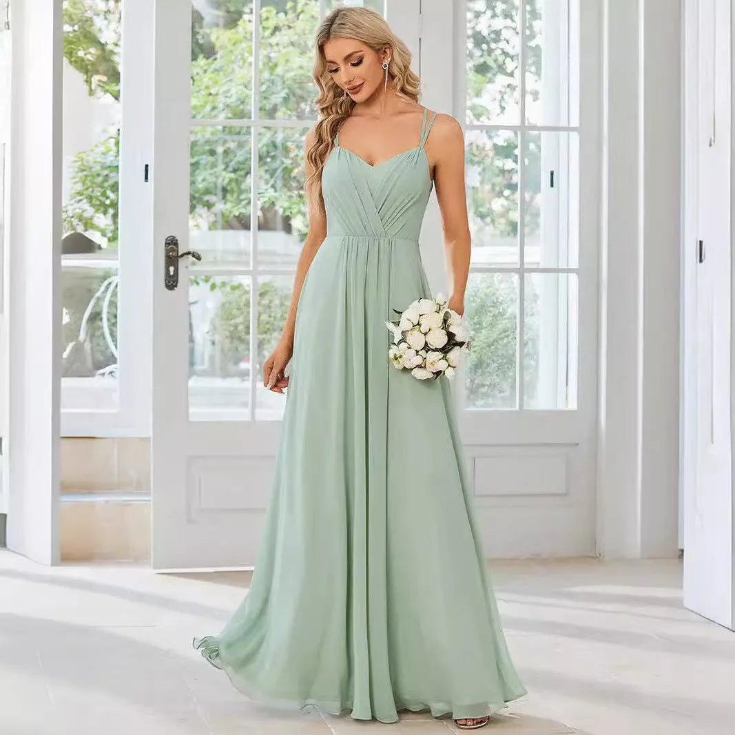 Long pleated A-line dress in light green with sleeveless sling neckline design.