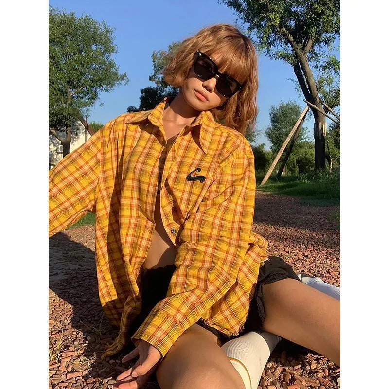 Dopamine yellow American plaid shirt with loose fit on hanger.