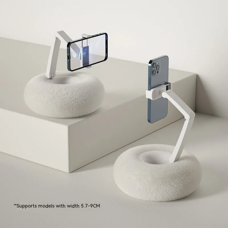 Adjustable rotating desk bracket holding a tablet, showing height extension and clamp mechanism.