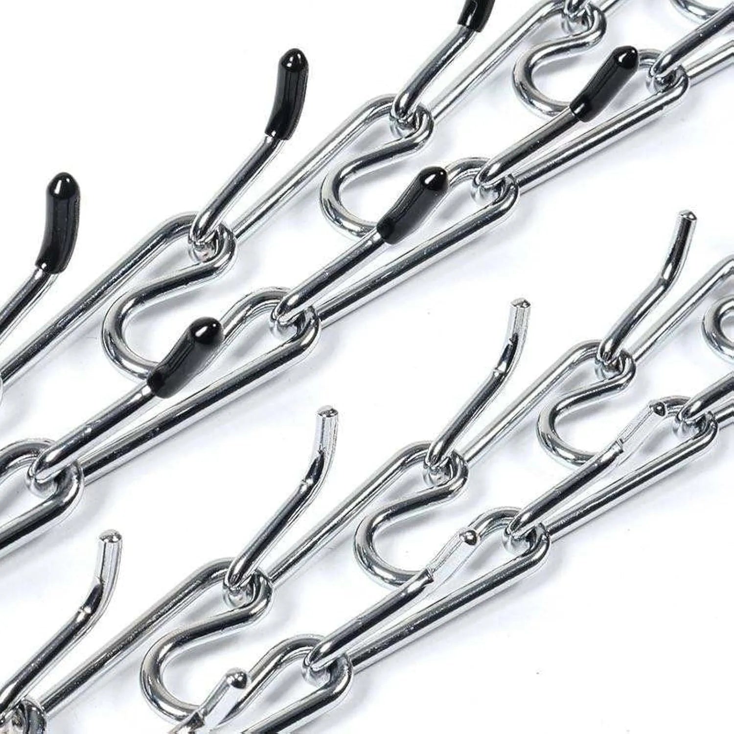 Stainless steel dog prong training collar with rubber tips and adjustable chain links on a grey background.