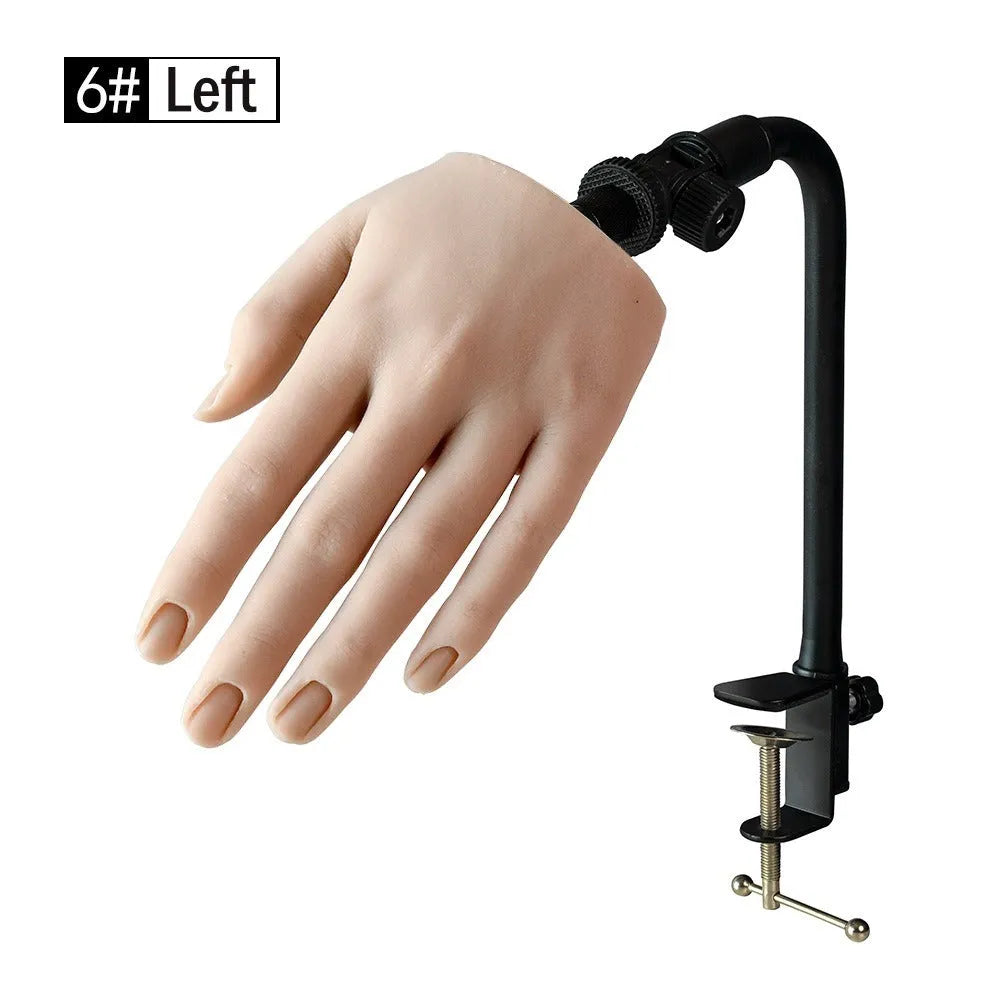 Silicone nail art practice hand model showing articulated fingers on a tabletop.