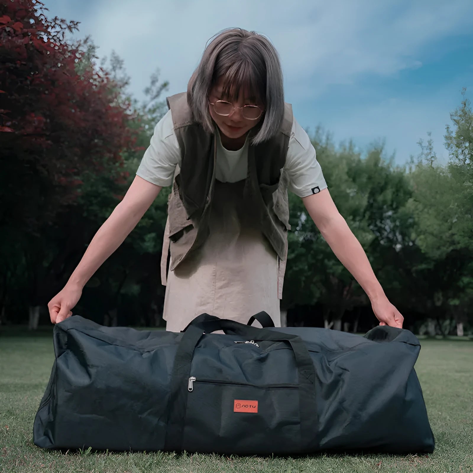 Large blue waterproof storage bag for camping tents and folding chairs showing expanded and compressed sizes