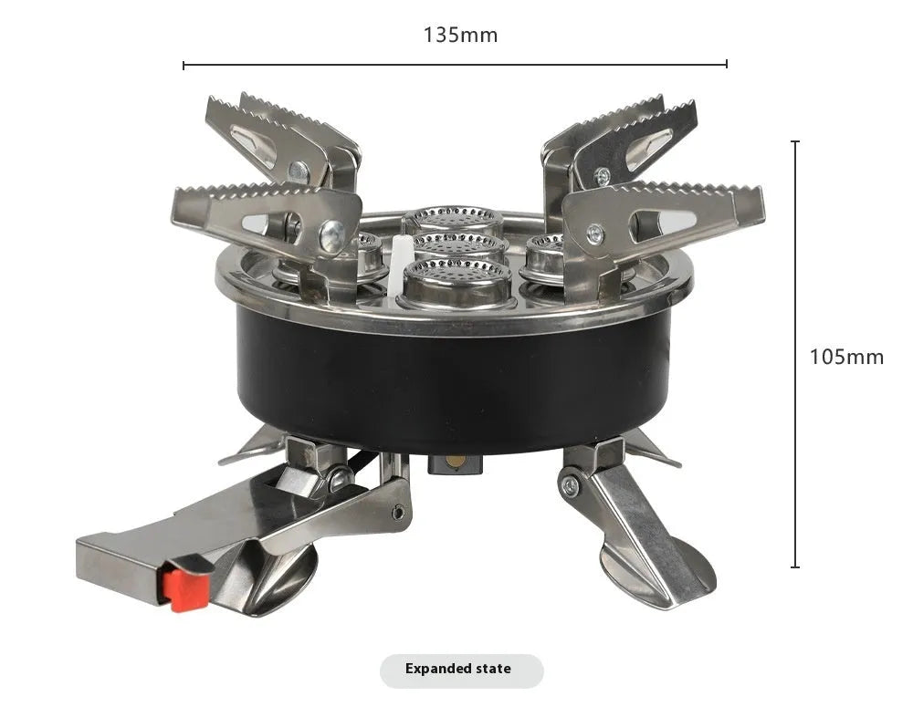 Silver portable split stove for outdoor camping and picnics on a flat surface.