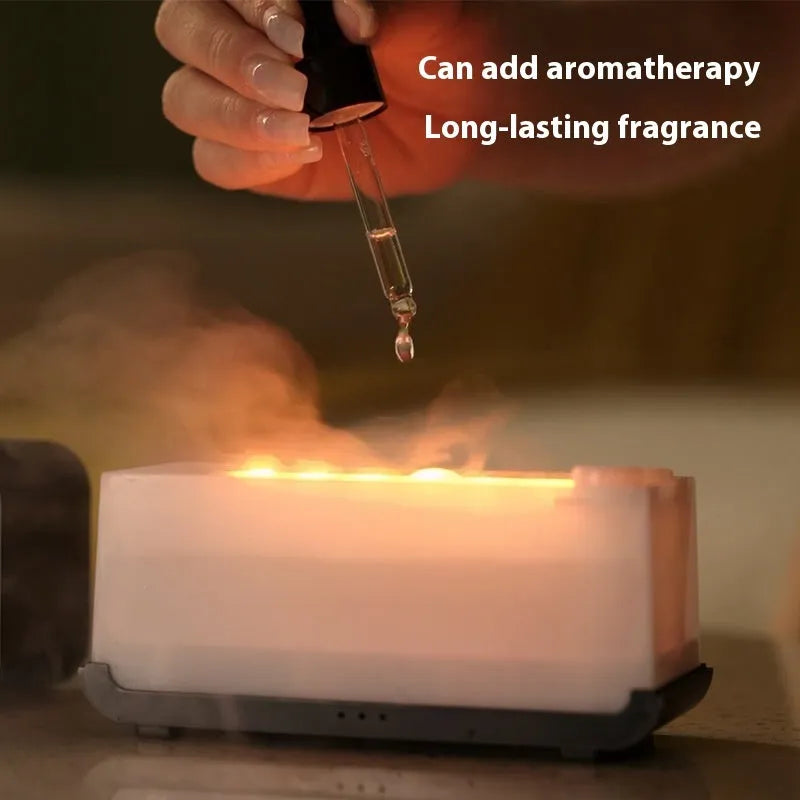Black and white USB aromatherapy diffuser with simulated flame effect showing mist output.
