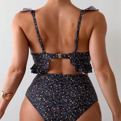 Women's backless floral print split swimsuit with pink, green, blue, purple flowers on black background