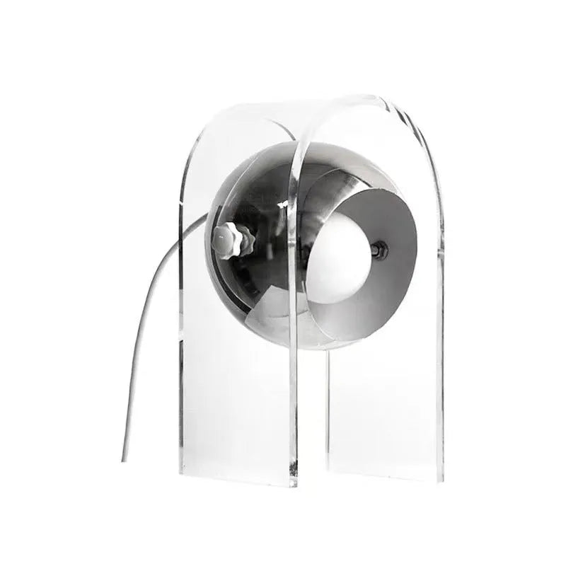 Modern minimalist acrylic table lamp with wrought iron base, 190x330mm, on a bedside table