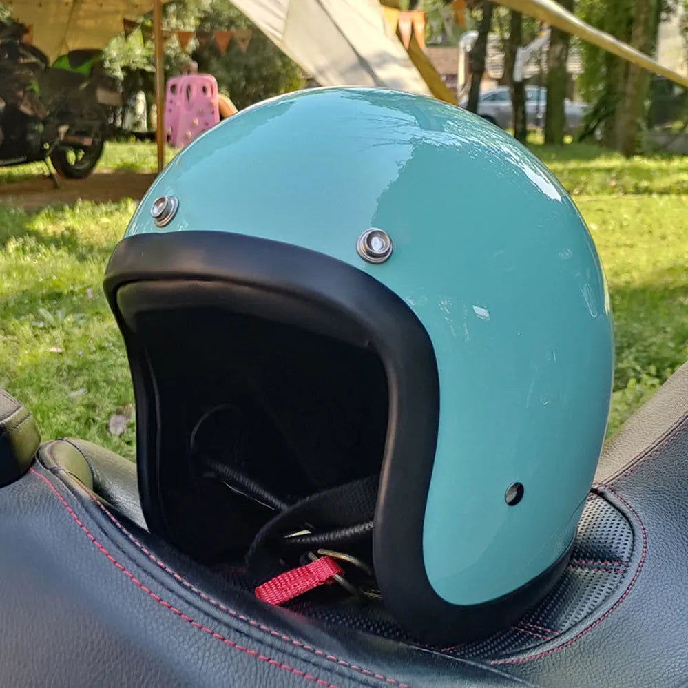 Glass fibre FRP retro half motorcycle helmet shown in a cement grey colour.