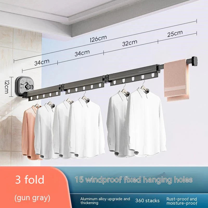 Aluminum retractable clothes drying rack mounted on wall with suction cups
