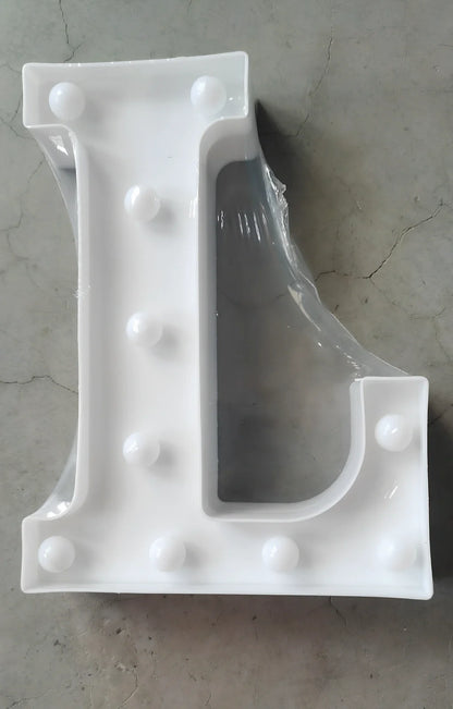 White plastic LED alphabet marquee sign with warm white illumination, 22cm height with battery operation