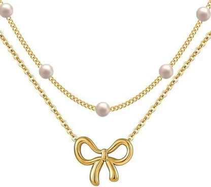 Double layer pearl choker with bow pendant in gold and silver options