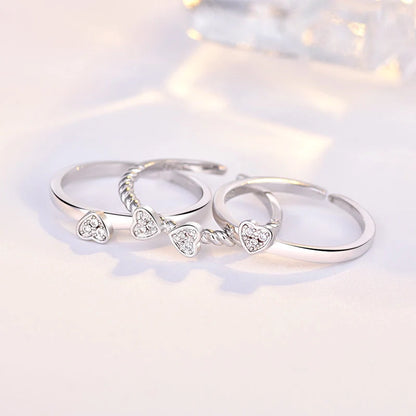 Adjustable four-leaf clover ring with spinning top design and zircon accents