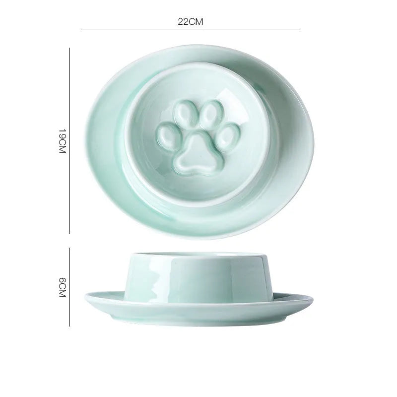 Ceramic slow feed pet bowl in green with internal ridges and neck protection design.
