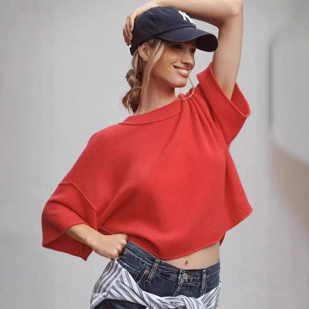 Red viscose short T-shirt with an exposed navel design on a mannequin, front view.