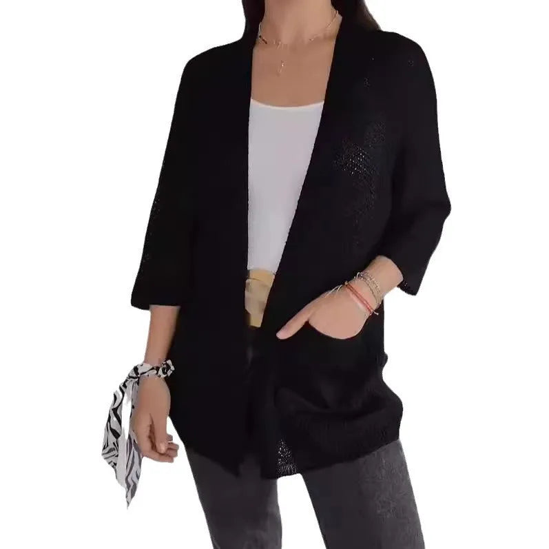 Women's waffle texture cardigan coat in army green with nine-quarter length sleeves and pockets.