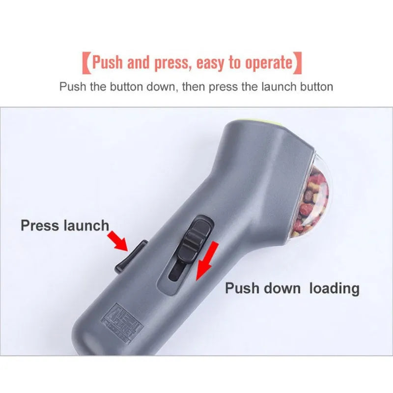 Grey plastic pet snack catapult launcher measuring 18cm with spring trigger mechanism