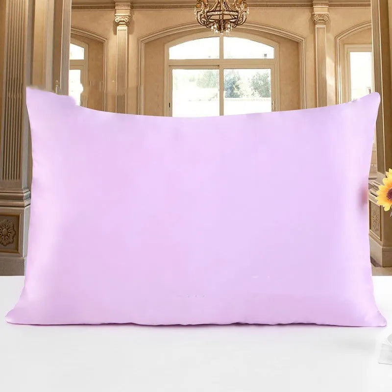 19 M double-sided silk pillowcase shown in one of 14 colours, including apricot, champagne, and navy blue.