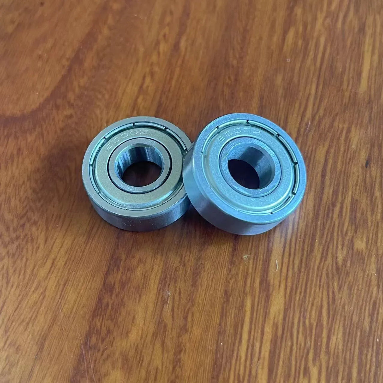 6000zz carbon steel miniature ball bearing showing 10mm inner diameter and 26mm outer diameter.