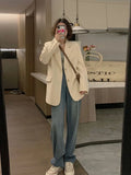 Korean style small suit jacket in solid colour with long sleeves and pockets.