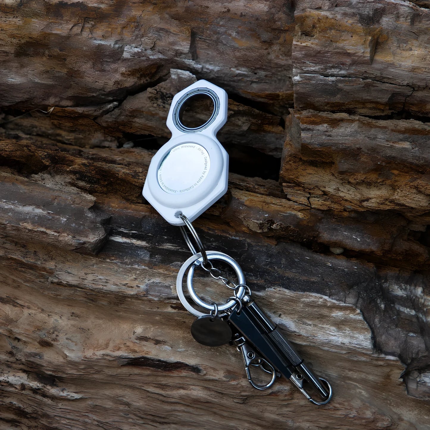 White zinc alloy Apple AirTag keychain case with protective cover and swivel keyring