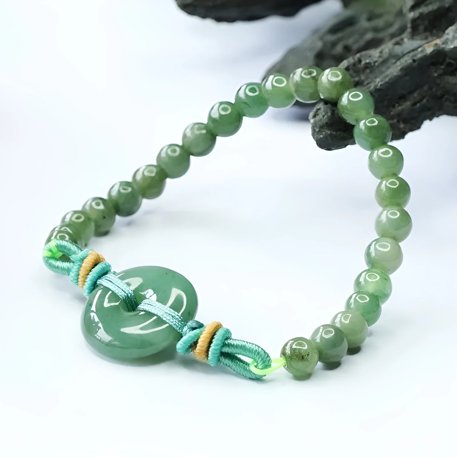 Jade bracelet with safety buckle showing emerald green 6mm star beads in national style design