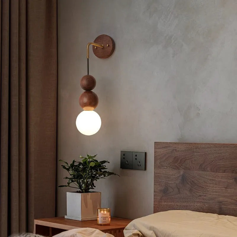 Wood and copper wall lamp with lollipop shade and tri-colour light for bedside or living room.