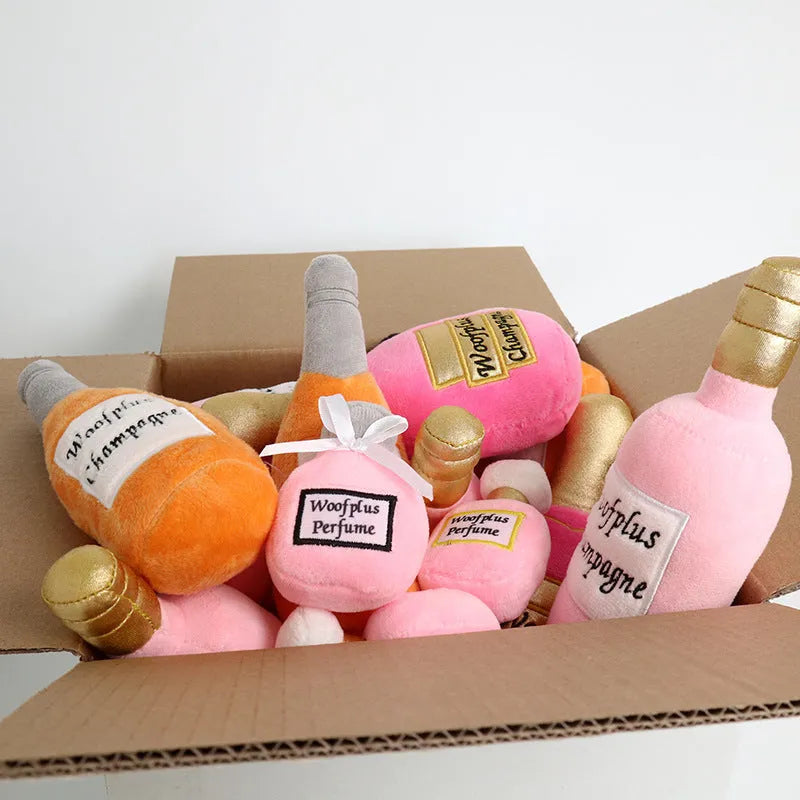 Soft green plush dog toy shaped like a wine bottle with a squeaker inside.