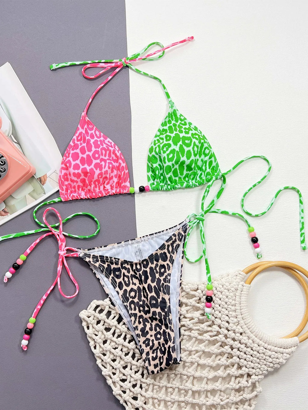 Women's leopard print bikini swimsuit with split-style briefs showing bra and matching briefs