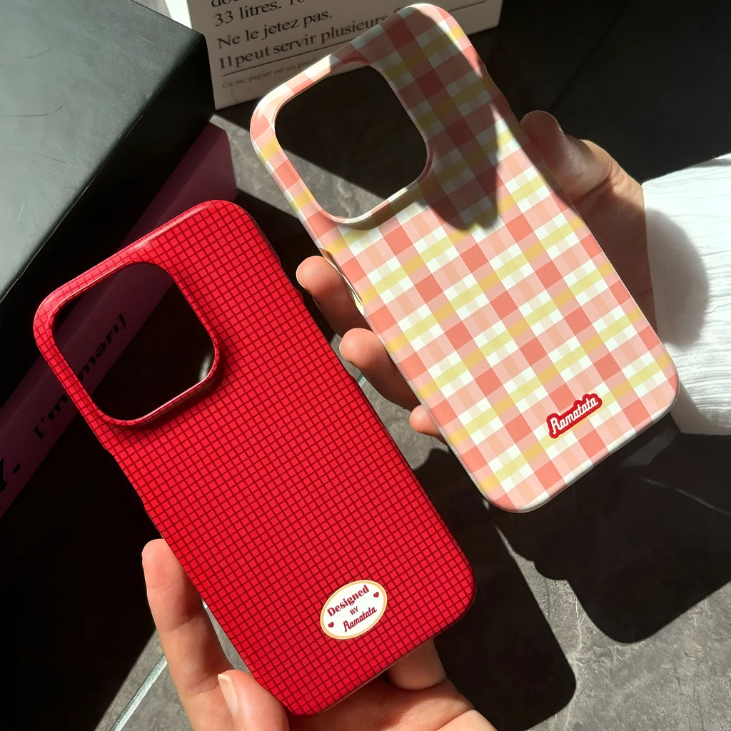 iPhone 15 Pro Max phone case with red plaid design and anti-fingerprint finish.
