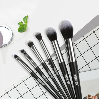 Six makeup brushes with black synthetic bristles and natural wood handles measuring 15cm