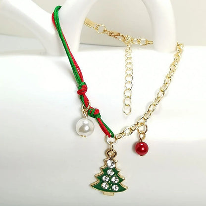 Christmas charm bracelet with snowman, Santa Claus, and snowflake designs