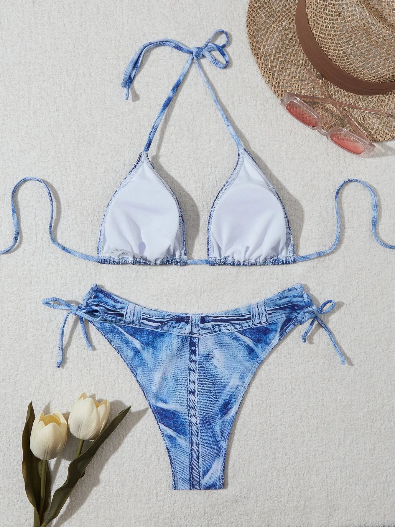 Denim blue printed bikini set with criss-cross straps on the top.