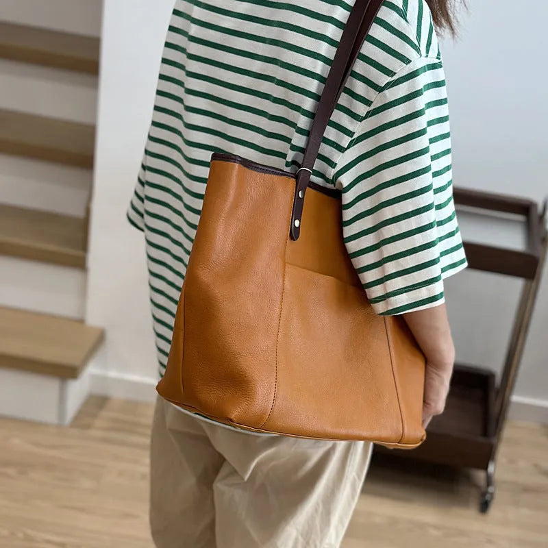 Horizontal square first-layer cowhide leather single-shoulder bag in brown with sewing thread detail and multiple pockets