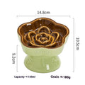 Black ceramic pet bowl with a high foot neck protector on a flat surface.