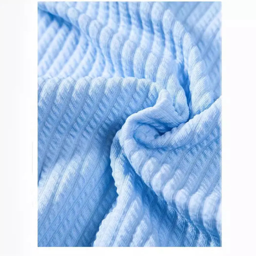 Short sleeve loose polyester fibre men's summer shirt in light blue, shown front view on plain background