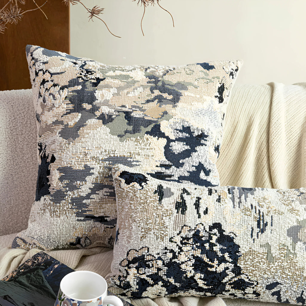 Antique blue decorative pillow with floral plant pattern, shown in square and waist pillow sizes.