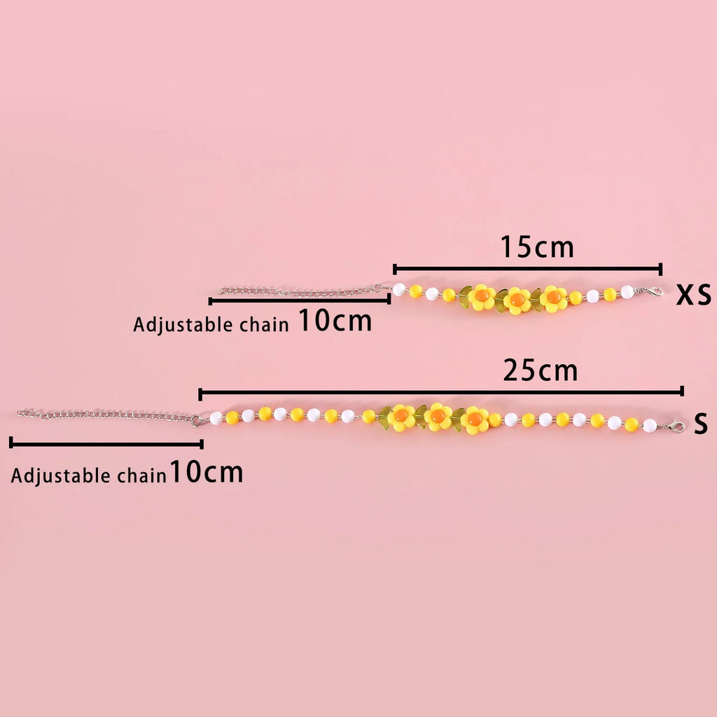 Colourful plastic bead necklace for cats in peach, rainbow, or small flower patterns with adjustable XS or S sizing