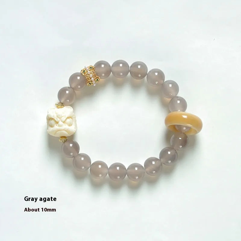 Grey agate melilite bracelet with 10mm round beads and hand-woven construction