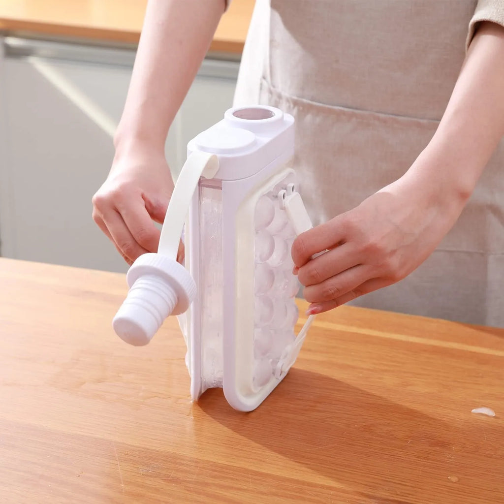 Light blue and white portable ice ball kettle with 17 spherical moulds and bottle function
