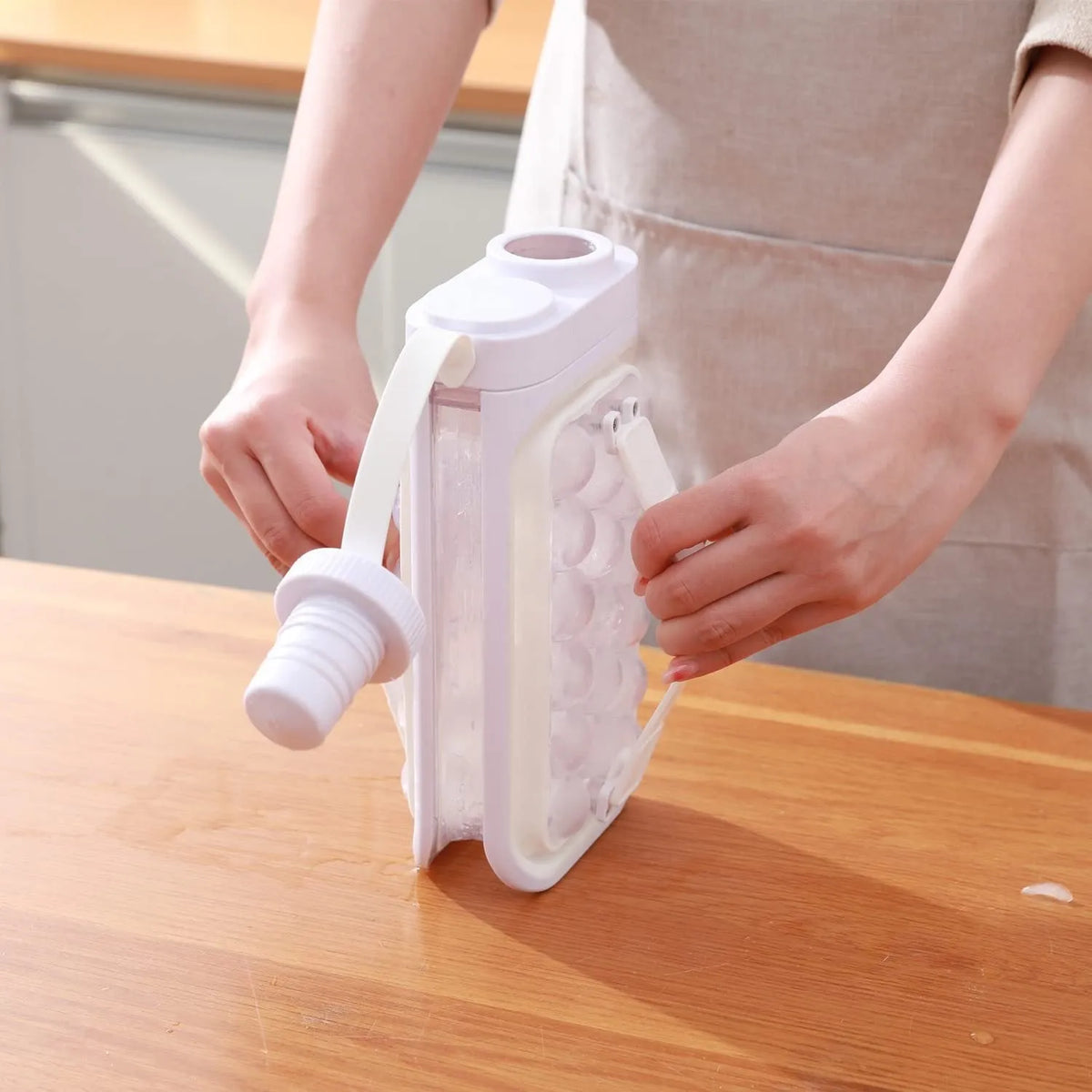 Light blue and white portable ice ball kettle with 17 spherical moulds and bottle function