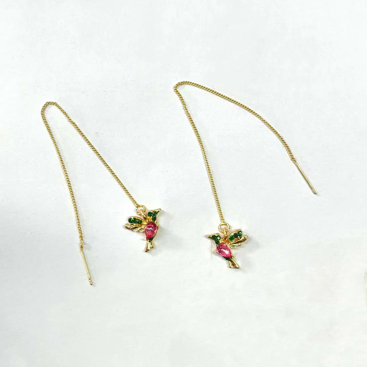 Long, dangling bird-shaped earrings with zirconium wing details in red, blue, and red lvzuan colour options.
