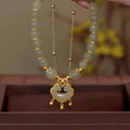 Green electroplated women's bracelet with safety lock pendant and double-layer design