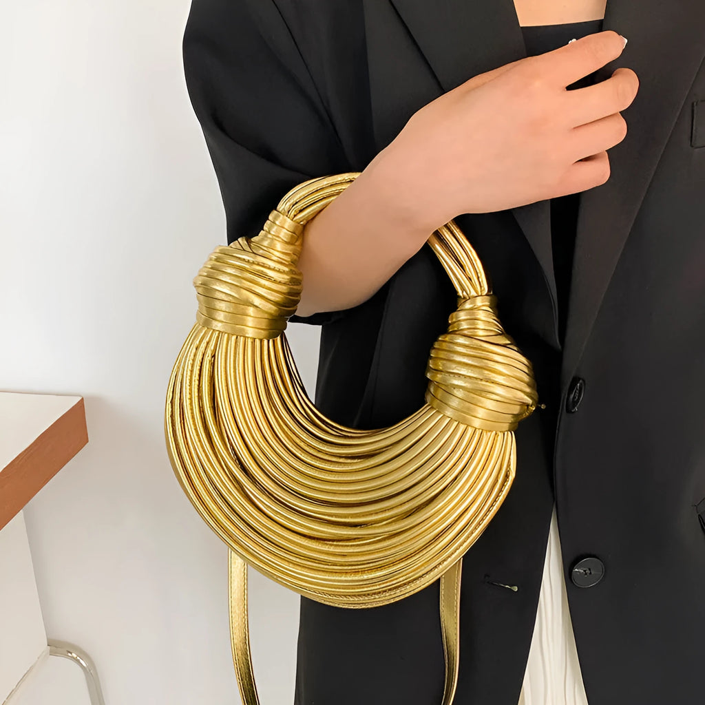 Instafamous Metal Noodles Underarm Bag with shiny metallic surface, chain detail, in gold colour